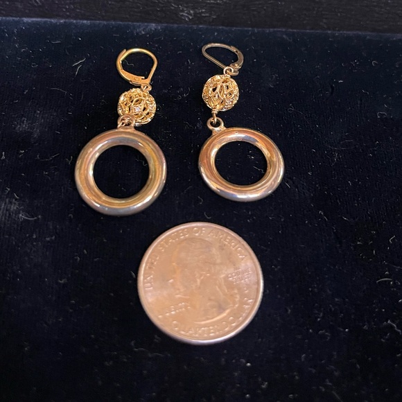 Silver and gold earrings with small crystals around ball. - Picture 1 of 2